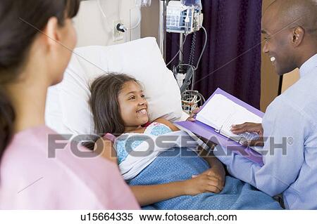 Doctor Making Notes On Patient View Large Photo Image Stock Photography - Doctor Making Notes On Patient. Fotosearch