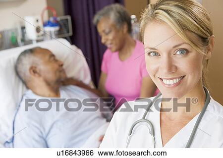 Doctor Smiling, Standing In Patients Room View Large Photo Image Stock Photograph - Doctor Smiling, Standing In Patients Room. Fotosearch