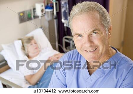 Doctor Standing And Smiling In Patients Room View Large Photo Image Stock Image - Doctor Standing And Smiling In Patients Room. Fotosearch
