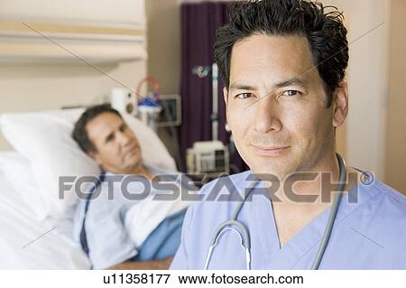 Stock Photo - Doctor Standing In Patients Room. Fotosearch