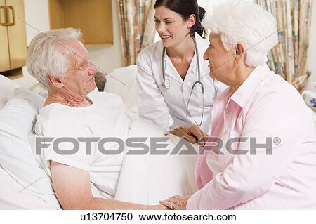 Doctor Talking To Senior Couple View Large Photo Image Stock Image - Doctor Talking To Senior Couple. Fotosearch