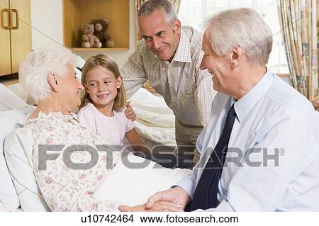 Family Sitting With Senior Woman In Hospital View Large Photo Image Picture - Family Sitting With Senior Woman In Hospital. Fotosearch