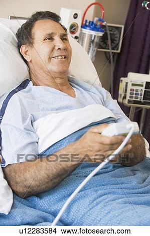 Middle Aged Man Pressing The Call Button In Hospital View Large Photo Image Picture - Middle Aged Man Pressing The Call Button In Hospital. Fotosearch