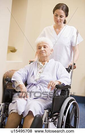Nurse Pushing Senior Woman In Wheelchair View Large Photo Image Stock Photo - Nurse Pushing Senior Woman In Wheelchair. Fotosearch