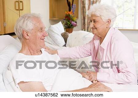 Senior Couple Sitting Together In Hospital View Large Photo Image Stock Image - Senior Couple Sitting Together In Hospital. Fotosearch