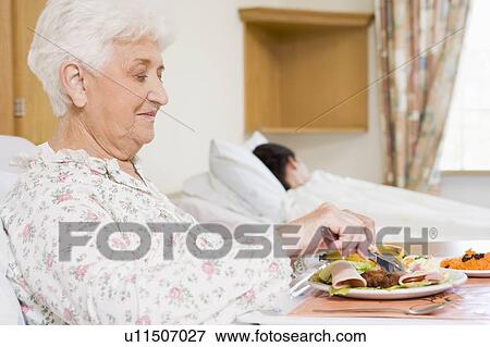 Senior Woman Eating Hospital Food View Large Photo Image Stock Photo - Senior Woman Eating Hospital Food. Fotosearch