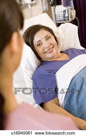 Senior Woman Lying In Hospital Bed, Smiling View Large Photo Image Stock Image - Senior Woman Lying In Hospital Bed, Smiling. Fotosearch