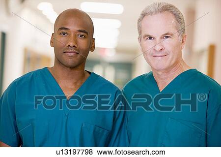 Two Orderlies Standing In A Hospital Corridor View Large Photo Image Stock Photo - Two Orderlies Standing In A Hospital Corridor. Fotosearch