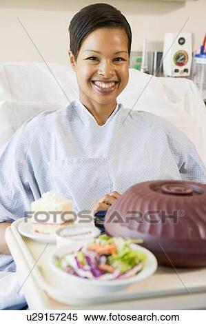 Woman Sitting In Hospital Bed With A Tray Of Food View Large Photo Image Stock Photography - Woman Sitting In Hospital Bed With A Tray Of Food. Fotosearch