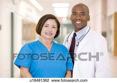 A Doctor And Nurse Standing In A Hospital Corridor View Large Photo Image Stock Image - A Doctor And Nurse Standing In A Hospital Corridor. Fotosearch