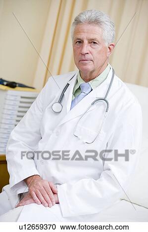 A Doctor Sitting On A Hospital Bed View Large Photo Image Stock Image - A Doctor Sitting On A Hospital Bed. Fotosearch