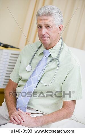 A Doctor Sitting On A Hospital Bed View Large Photo Image Stock Image - A Doctor Sitting On A Hospital Bed. Fotosearch