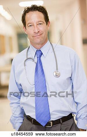 Stock Photo - Doctor Standing In A Hospital Corridor. Fotosearch