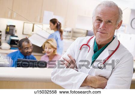 Stock Photo - Doctors And Nurses At The Reception Area Of A Hospital. Fotosearch