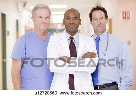 Doctors Standing In A Hospital Corridor View Large Photo Image Stock Image - Doctors Standing In A Hospital Corridor. Fotosearch