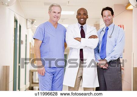Stock Photo - Doctors Standing In A Hospital Corridor. Fotosearch