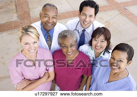 High Angle View Of Hospital Staff Standing Outside A Hospital View Large Photo Image Stock Photo - High Angle View Of Hospital Staff Standing Outside A Hospital. Fotosearch
