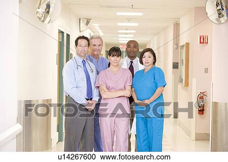 Stock Image - Hospital Team Standing In A Corridor. Fotosearch