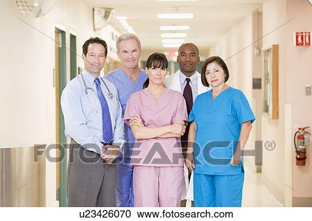 Stock Image - Hospital Team Standing In A Corridor. Fotosearch