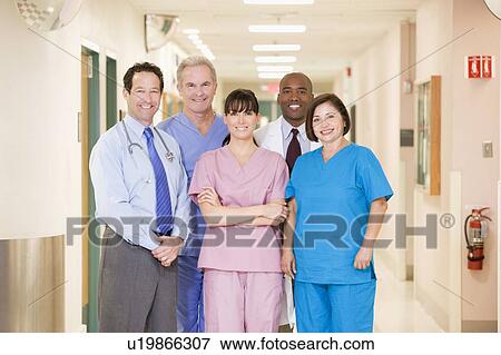 Hospital Team Standing In A Corridor View Large Photo Image Stock Photo - Hospital Team Standing In A Corridor. Fotosearch