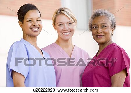 Nurses Standing Outside A Hospital View Large Photo Image Stock Photo - Nurses Standing Outside A Hospital. Fotosearch