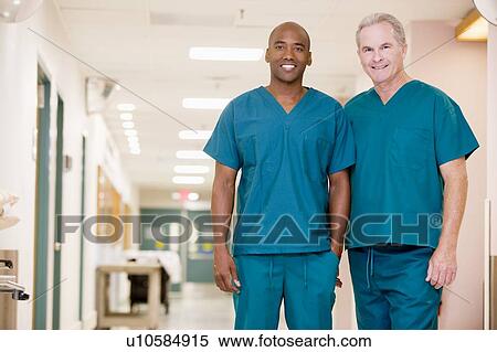 Two Orderlies Standing In A Hospital Corridor View Large Photo Image Stock Photography - Two Orderlies Standing In A Hospital Corridor. Fotosearch