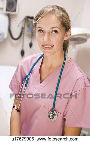 Stock Photograph - Young Female Doctor In Pink Scrubs. Fotosearch