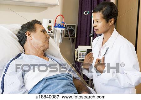 Doctor And Patient Talking To Each Other View Large Photo Image Stock Photo - Doctor And Patient Talking To Each Other. Fotosearch