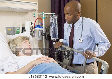 Doctor Checking Up On Patient In Hospital View Large Photo Image Stock Image - Doctor Checking Up On Patient In Hospital. Fotosearch