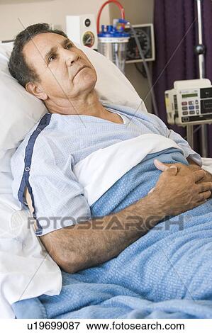 Middle Aged Man Lying In Hospital Bed View Large Photo Image Stock Photo - Middle Aged Man Lying In Hospital Bed. Fotosearch