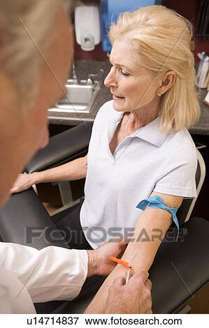 Middle Aged Woman Having Blood Test Done View Large Photo Image Stock Photo - Middle Aged Woman Having Blood Test Done. Fotosearch