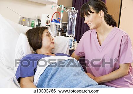 Stock Photograph - Nurse Talking To Patient. Fotosearch