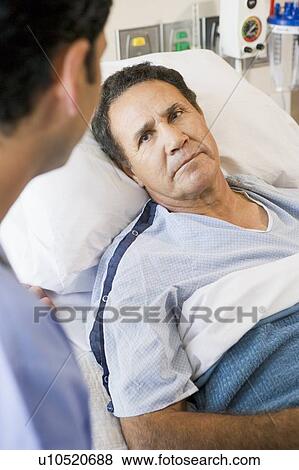 Stock Photo - Patient Looking At Doctor. Fotosearch