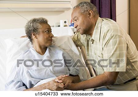 Senior Couple Standing In Hospital Together View Large Photo Image Stock Image - Senior Couple Standing In Hospital Together. Fotosearch