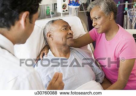 Senior Couple Talking To Doctor, Looking Worried View Large Photo Image Stock Photo - Senior Couple Talking To Doctor, Looking Worried. Fotosearch