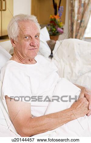 Senior Man Sitting In Hospital Bed View Large Photo Image Stock Photo - Senior Man Sitting In Hospital Bed. Fotosearch