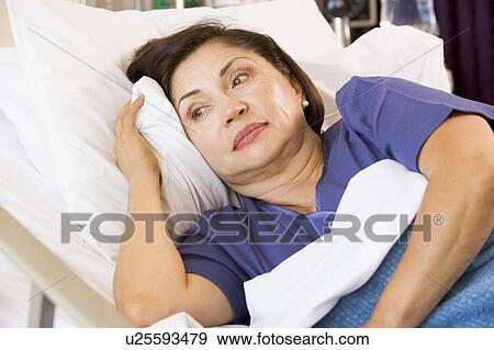 Senior Woman Lying Down In Hospital Bed View Large Photo Image Stock Photo - Senior Woman Lying Down In Hospital Bed. Fotosearch