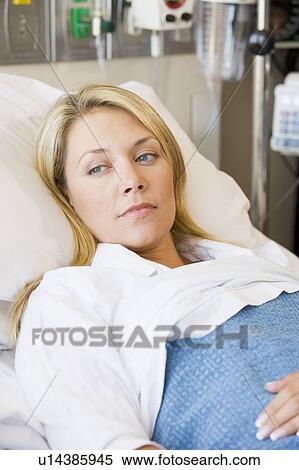 Stock Photography - Woman Lying In Hospital Bed. Fotosearch
