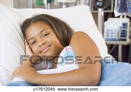 Stock Photography - Young Girl Resting In Hospital Bed. Fotosearch
