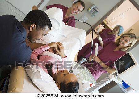 Picture - Doctor retrieving eggs from ovary using vaginal ultrasound. Fotosearch