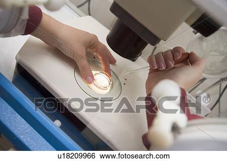 Embryologist adding sperm to egg View Large Photo Image Stock Photograph - Embryologist adding sperm to egg. Fotosearch