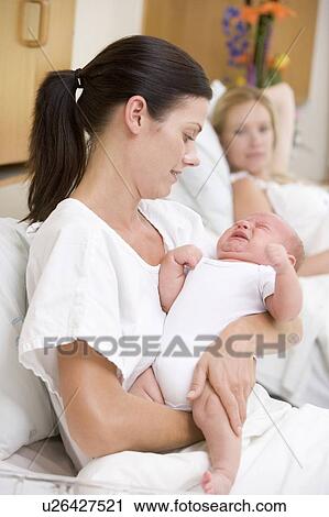 New mother with crying baby in hospital View Large Photo Image Stock Image - New mother with crying baby in hospital. Fotosearch
