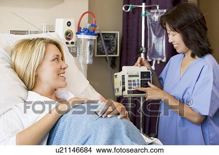 Picture - Pregnant Woman Lying In Hospital Bed. Fotosearch