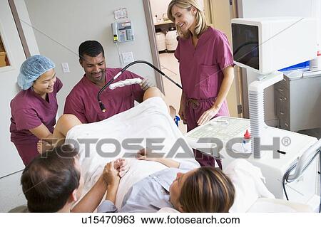 Stock Image - Retrieval of eggs from ovary using vaginal ultrasound. Fotosearch