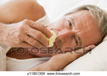 Stock Photo - Man Blowing His Nose. Fotosearch