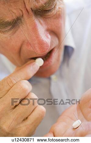 Man Taking Pills View Large Photo Image Stock Image - Man Taking Pills. Fotosearch