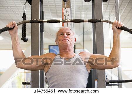 Man Weight Training At Gym View Large Photo Image Stock Image - Man Weight Training At Gym. Fotosearch