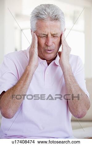 Picture - Man With A Headache. Fotosearch