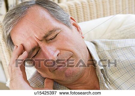 Stock Photo - Man With A Headache. Fotosearch