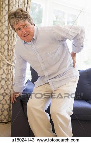 Stock Image - Man With Back Pain. Fotosearch
